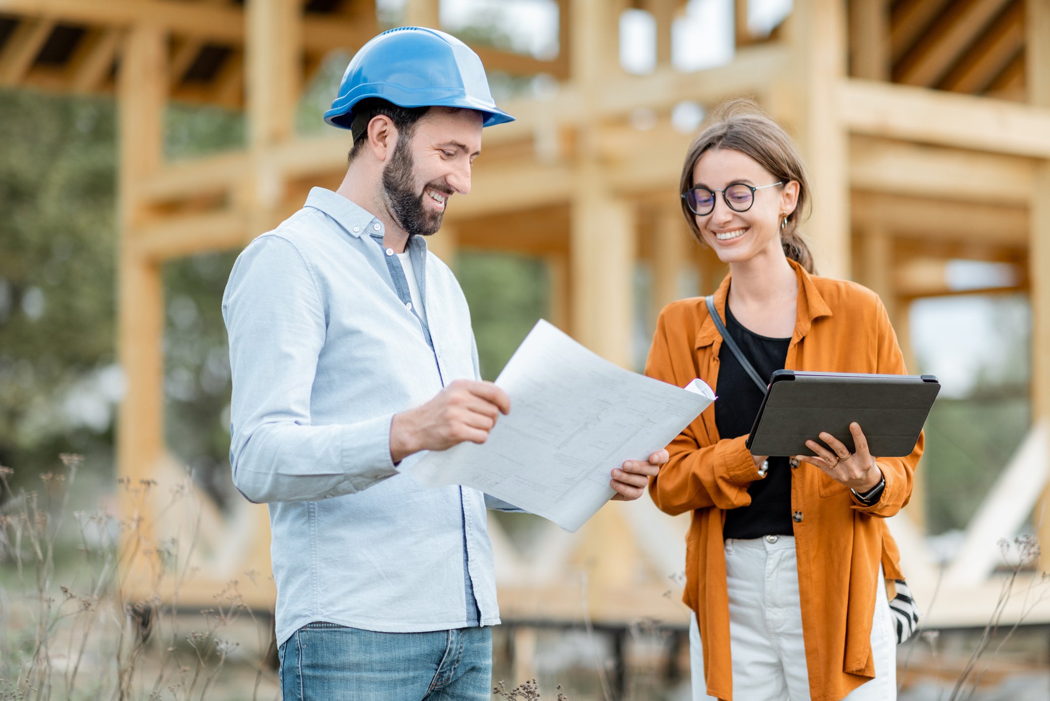 Builder with a Female Client  at the Construction Site